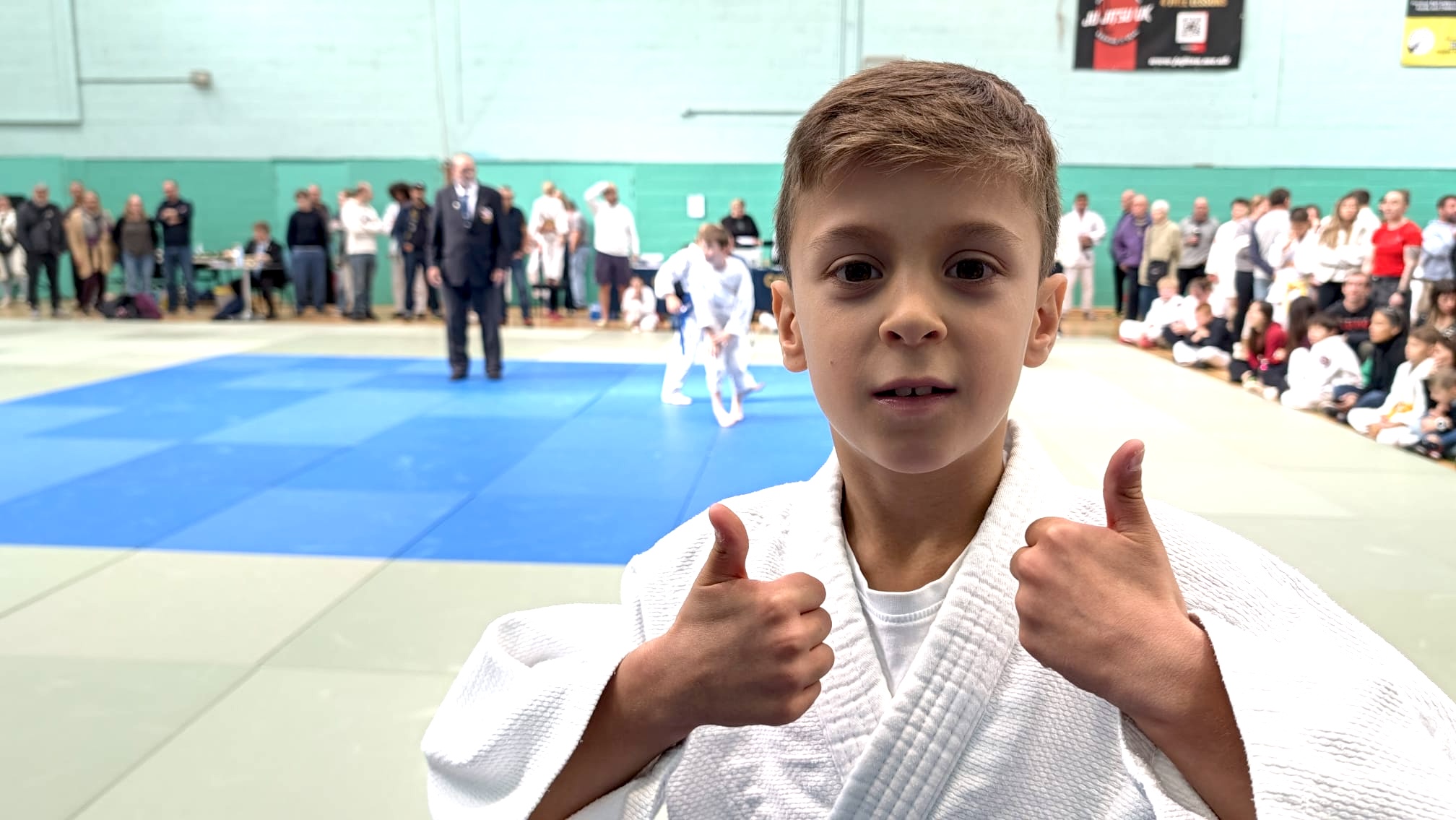 A young Ely Dojo member showing confidence at a judo competition